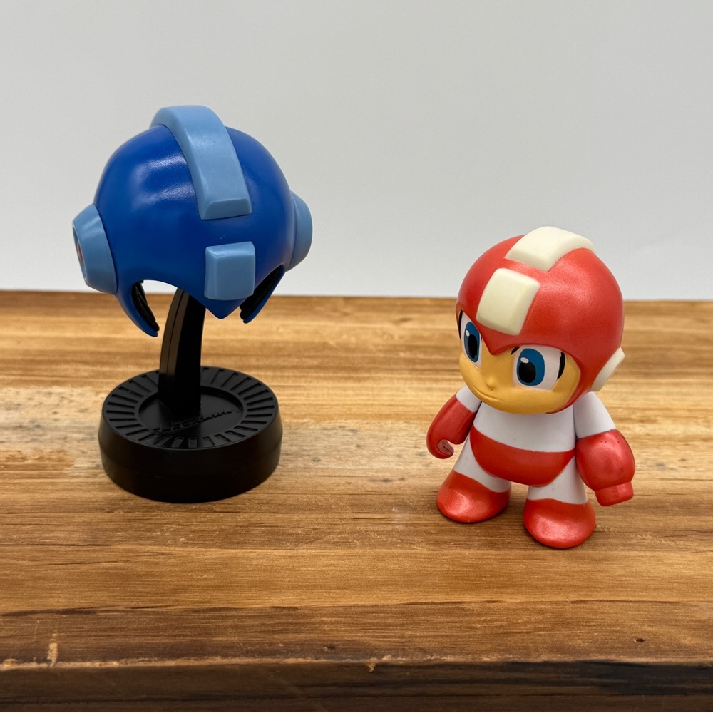 Mega Man Figurine Duo - Red 3” Mini and Blue Helmet on Stand